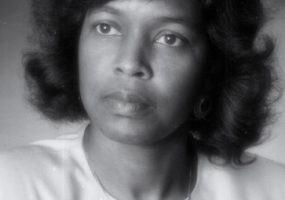 portrait photo of African-American woman with wavy hair