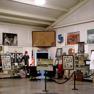 Military artifacts and displays behind a rope