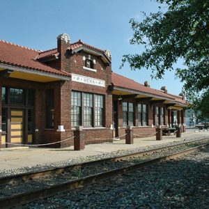 Brick train station and tracks on gravel