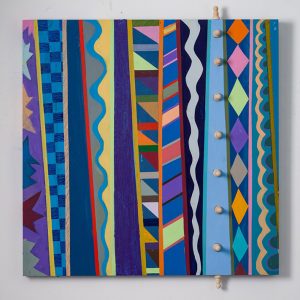 Multicolored geometric patterns and knobs on canvas