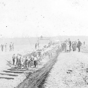 Railroad workers laying tracks