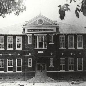 Multistory building with "Kingsland High School" sign above second story windows