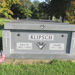 "Klipsch" above ground grave site in cemetery