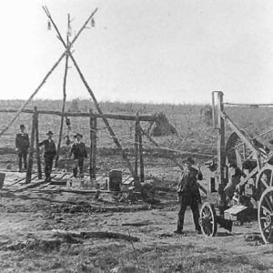 Group of men in hats with mining equipment