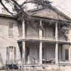 Two-story house with covered porch and balcony