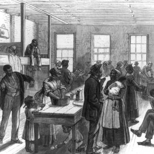 African American adults and children gathered in large room with beds and tables