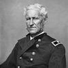 Old white man sitting in military uniform