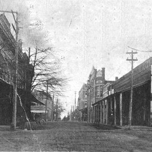 View looking down town street with storefronts on both sides