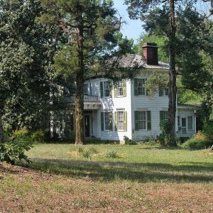 Two-story house with trees in front yard