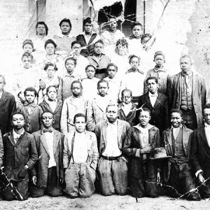 Group of African-American students outside school building