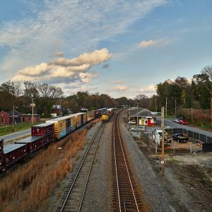 Three railroad tracks, one with a train on it