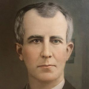 Old white man in suit with bow tie