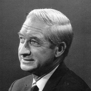 Side view of white man in suit jacket and tie