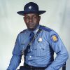 African-American man in State police uniform with hat