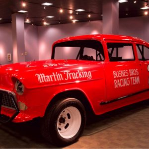 Red number 2 car on display in a showroom