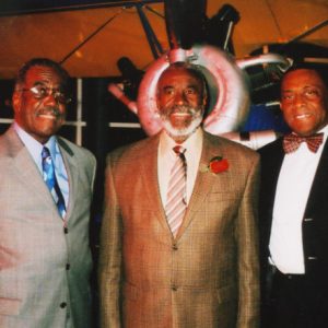 Older African-American men in suits standing together