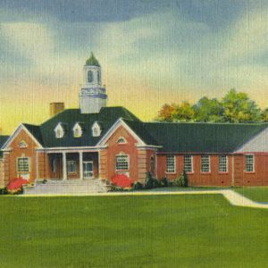 Multistory brick building with cupola and walking paths on post card