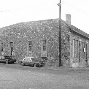 Rear of building with stone walls on street