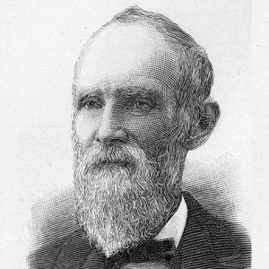 Old white man with long beard in suit and tie