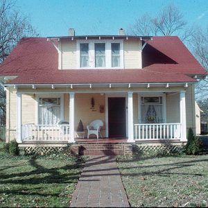 Two-story house with covered porch and front yard