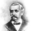 Older white man with thick mustache in suit and bow tie