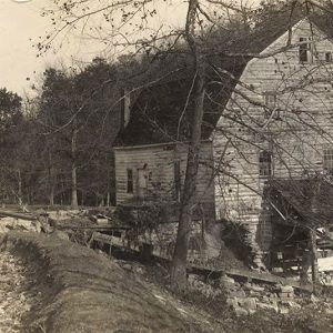 Multistory building with wood siding and gambrel roof