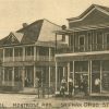 Two-story motel building and drug store with customers on post card