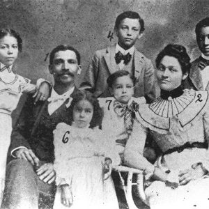 African-American man woman and their children in family photograph with numbers written on each person