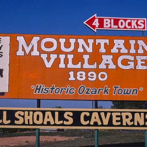 "Mountain Village 1890" and "Bull Shoals Caverns" billboards