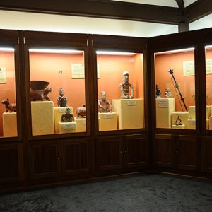 Row of display cases with artifacts behind glass