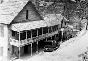 Multi-story building with balcony and covered porch