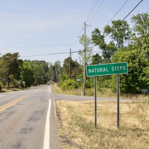 "Natural steps" sign and paved roads