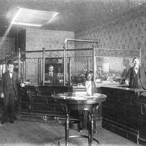 Several men standing in bank