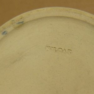 "Niloak" stamp on bottom of pottery