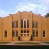 brick building with windows and pointed roof