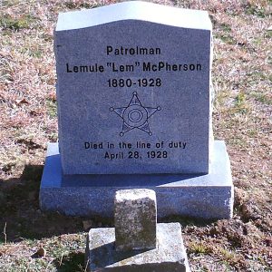 Gravestone with star shield engraved on it in cemetery