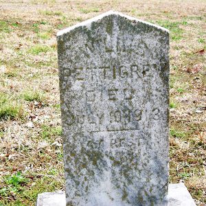 Weathered gravestone in cemetery