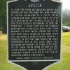 "Austin" historical marker sign on grass