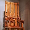 Wooden electric chair with leather straps on display