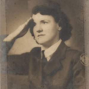 Young white woman in military uniform doing a salute with her right hand