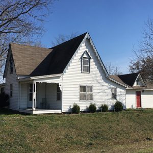 Two-story house with corner porch and side entrance