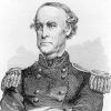 Old white man in military uniform with his arms crossed