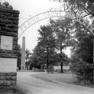 Entrance to park with iron arch over entrance "Prairie Grove Battlefield"