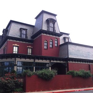 Rear view of multistory house on parking lot