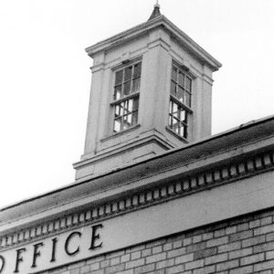 Close-up of cupola with windows and wind vane on top