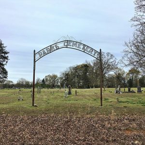 "Paris Cemetery" arch entrance to cemetery