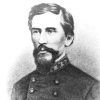 White man with mustache and beard in military uniform