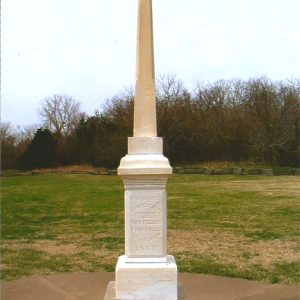 Urn on top of obelisk shaped monument with engraved base