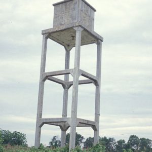 square concrete water tower in field