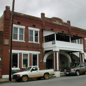 Multistory brick building with covered balcony